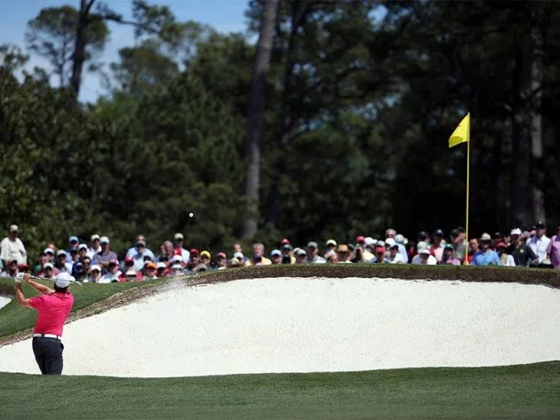 Rory McIlroy hits from the fairway bunker on No. 2 during the final round of the 2011 Masters Tournament